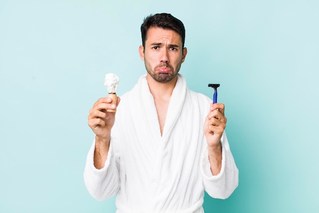 Young hispanic man shaving concept