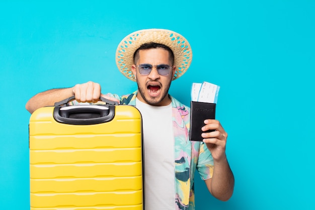 Young hispanic traveler man angry expression