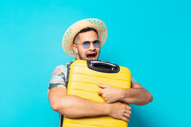 Young hispanic traveler man angry expression