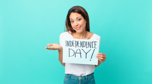 Young hispanic woman feeling puzzled and confused and doubting. independence day concept