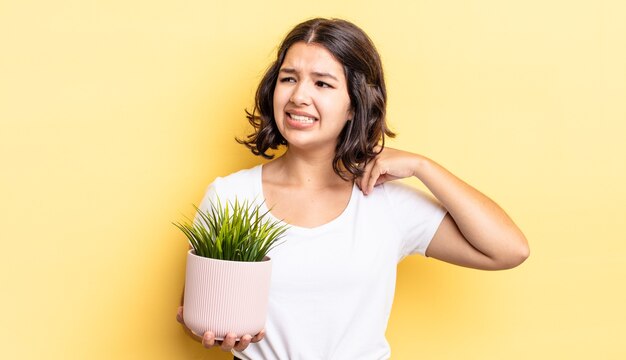 Young hispanic woman feeling stressed, anxious, tired and frustrated. growth concept