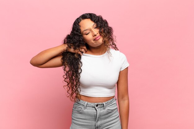 Young hispanic woman feeling stressed, anxious, tired and frustrated, pulling shirt neck, looking frustrated with problem