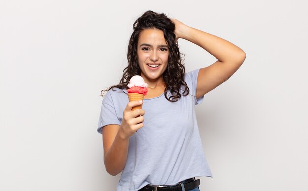 Young hispanic woman feeling stressed, worried, anxious or scared, with hands on head, panicking at mistake