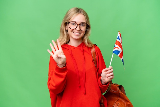 Young hispanic woman holding an United Kingdom flag over isolated background happy and counting four with fingers