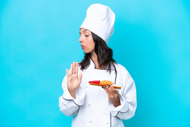 Young hispanic woman over isolated background