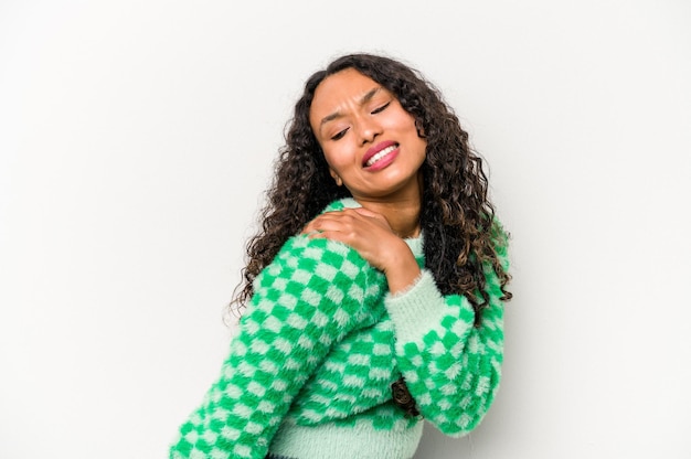 Young hispanic woman isolated on white background having a shoulder pain