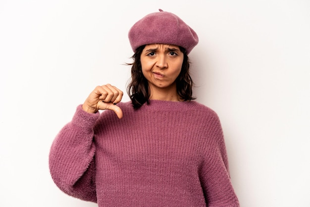 Young hispanic woman isolated on white background showing thumb down disappointment concept