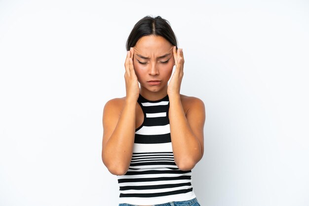 Young hispanic woman isolated on white background with headache