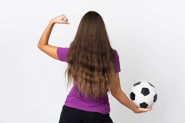 Young hispanic woman over isolated white wall with soccer ball