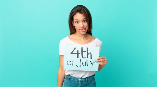 Young hispanic woman looking puzzled and confused. independence day concept