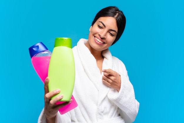 Young hispanic woman with facial clean and care products