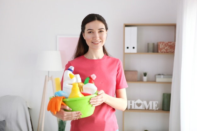 Young housewife is doing house cleaning closeup