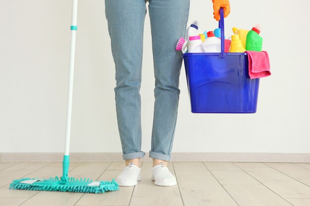 Young housewife is doing house cleaning closeup