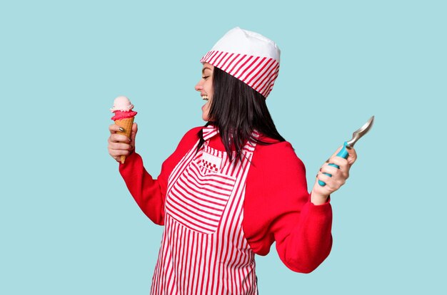 A young ice cream vendor in vintage attire holds a sweet cone smiling happily