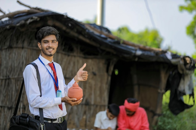 Young indian banker visit to farmer at home