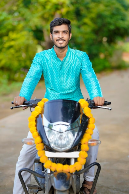 Young indian boy with new bike