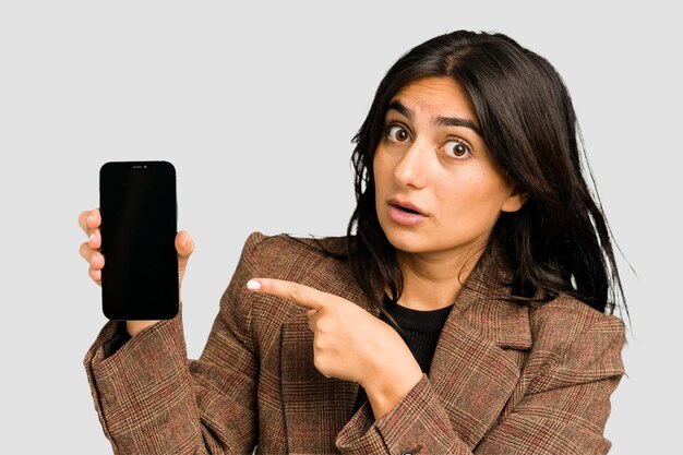 Young indian business woman showing her mobile phone isolated cut out