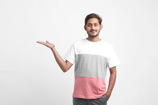 Young Indian college boy Showing Direction With Hand