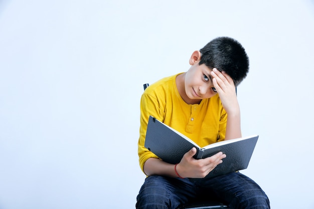 Young indian cute boy with notebook