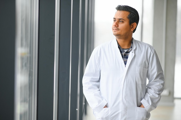 Young indian doctor man standing