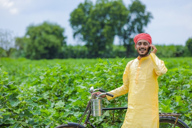 Young Indian farmer in a field