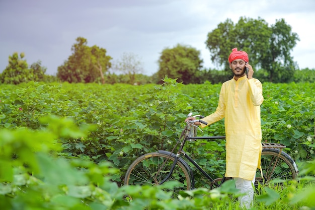 Young Indian farmer in a field