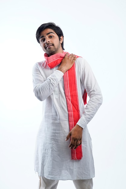 Young indian farmer giving expression on white background