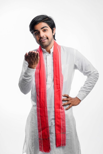 Young indian farmer giving expression on white background