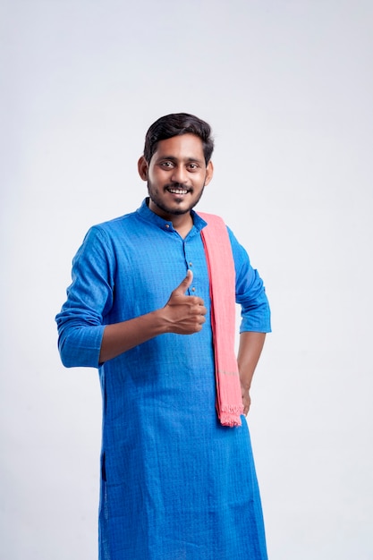 Young indian farmer giving expression on white background.