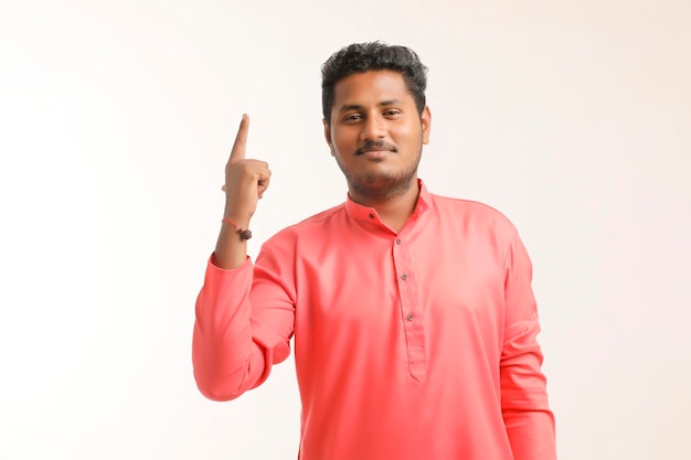 Young indian farmer giving expression on white background.