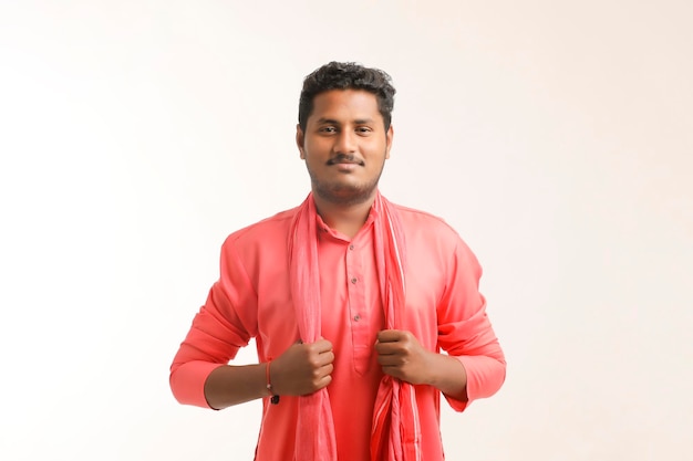 Young indian farmer giving expression on white background.