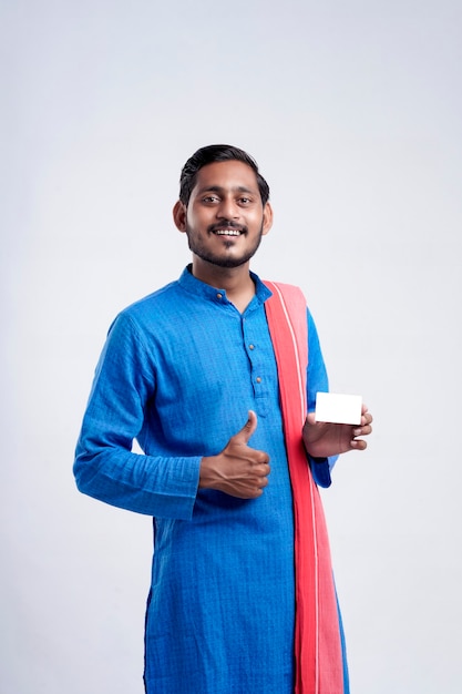 Young indian farmer showing card on white background