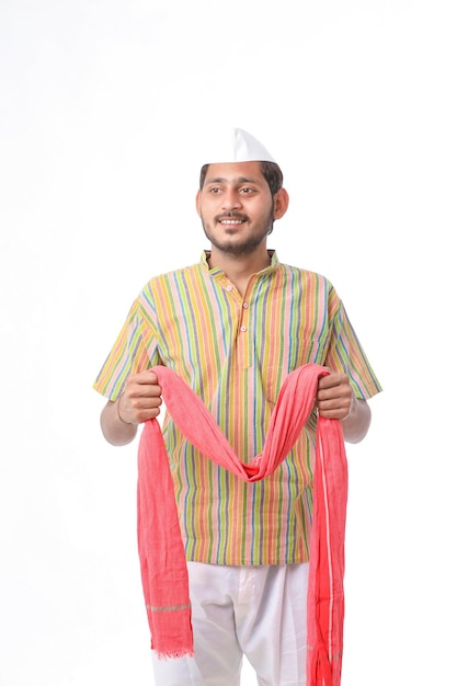 Young indian farmer in traditional wear and giving expression on white background.