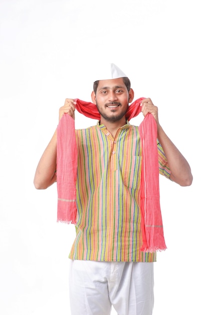 Young indian farmer in traditional wear and giving expression on white background.