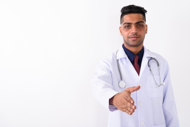 Young Indian man doctor on white