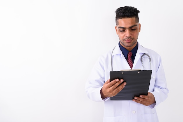 Young Indian man doctor on white