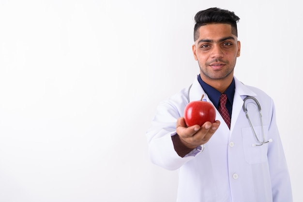 Young Indian man doctor on white