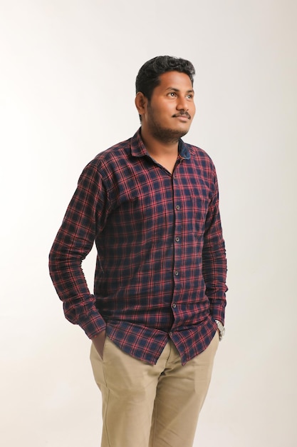 Young indian man giving expression with hand over white background.