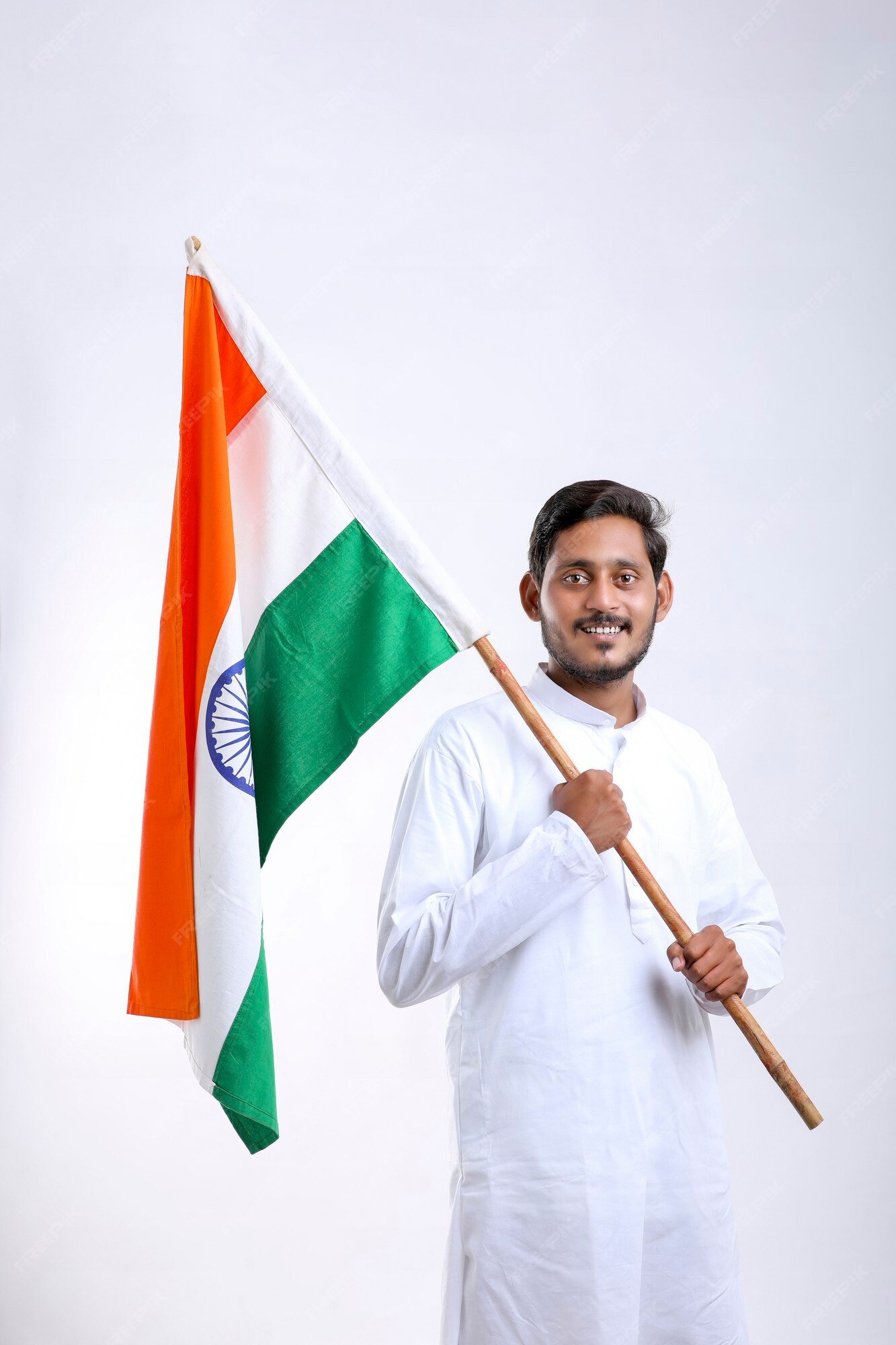 Premium Photo | Young indian man holding indian national flag in hand over white  background