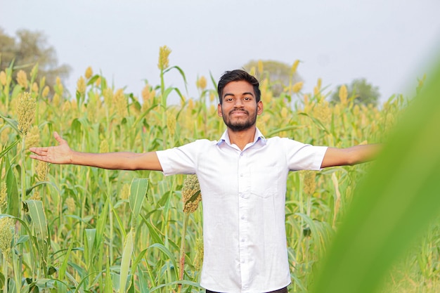 Young indian man Jump in air at agriculture field