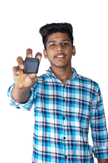 Young indian man showing air buds white background.