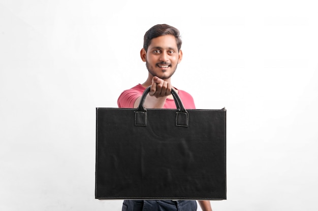 Young indian man showing excitement with shopping bags