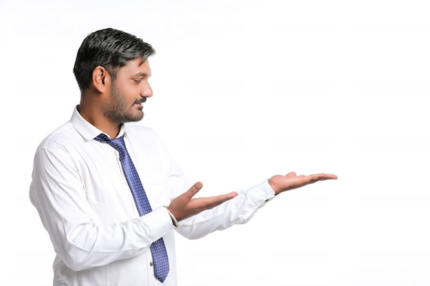 Young indian man showing expression on white background