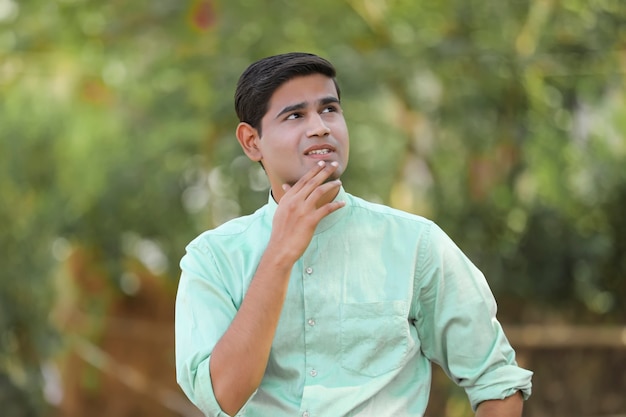 Young indian man thinking