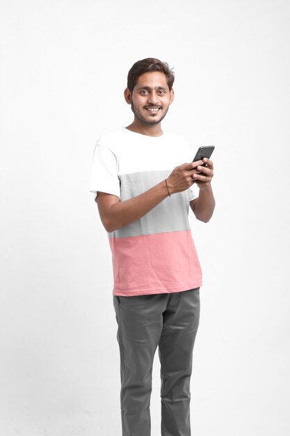 Young Indian man using mobile