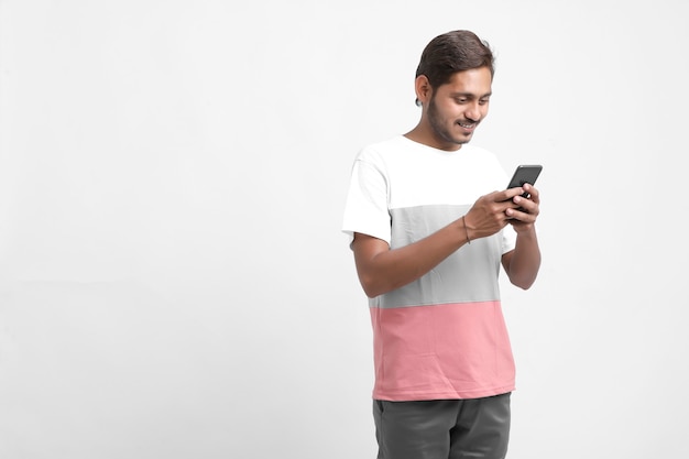 Young Indian man using mobile