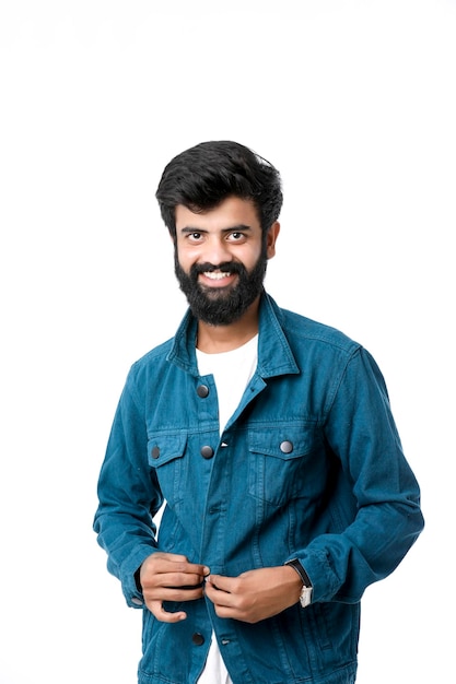 Young indian man wear jacket and giving expression over white background