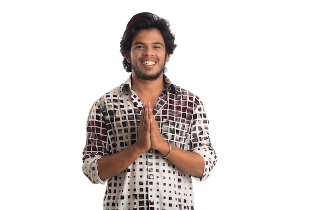 Young Indian man on white background