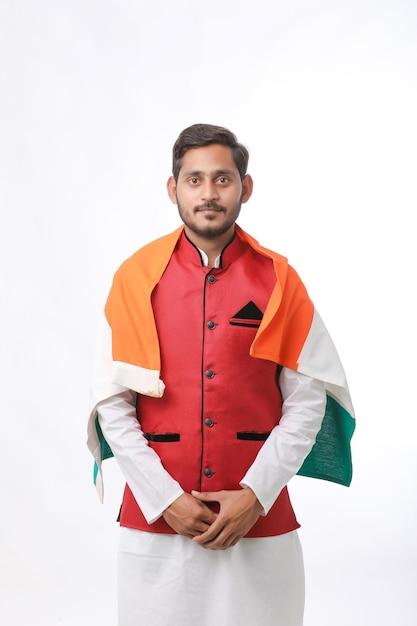 Young indian man with indian flag on white background.