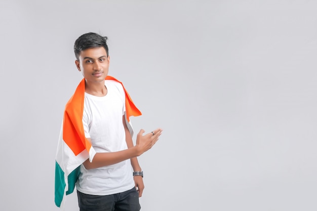 Young indian man with indian flag